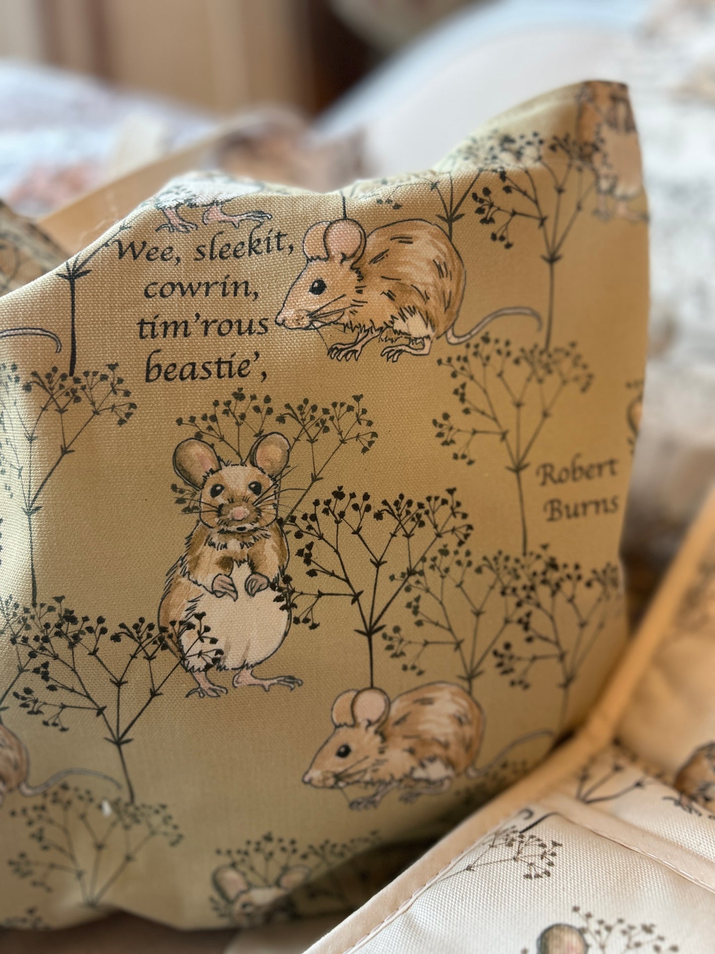 Close up of design details of tote bag. Mice twigs with wee beastie quote