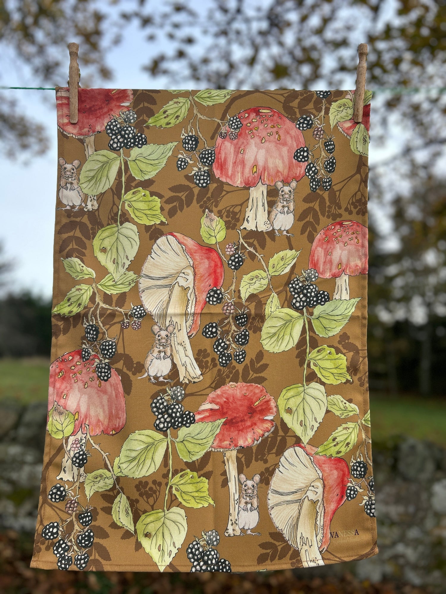 Orange toadstool illustrations with brambles and a little mouse, on a berry silhouette background. Tan base  