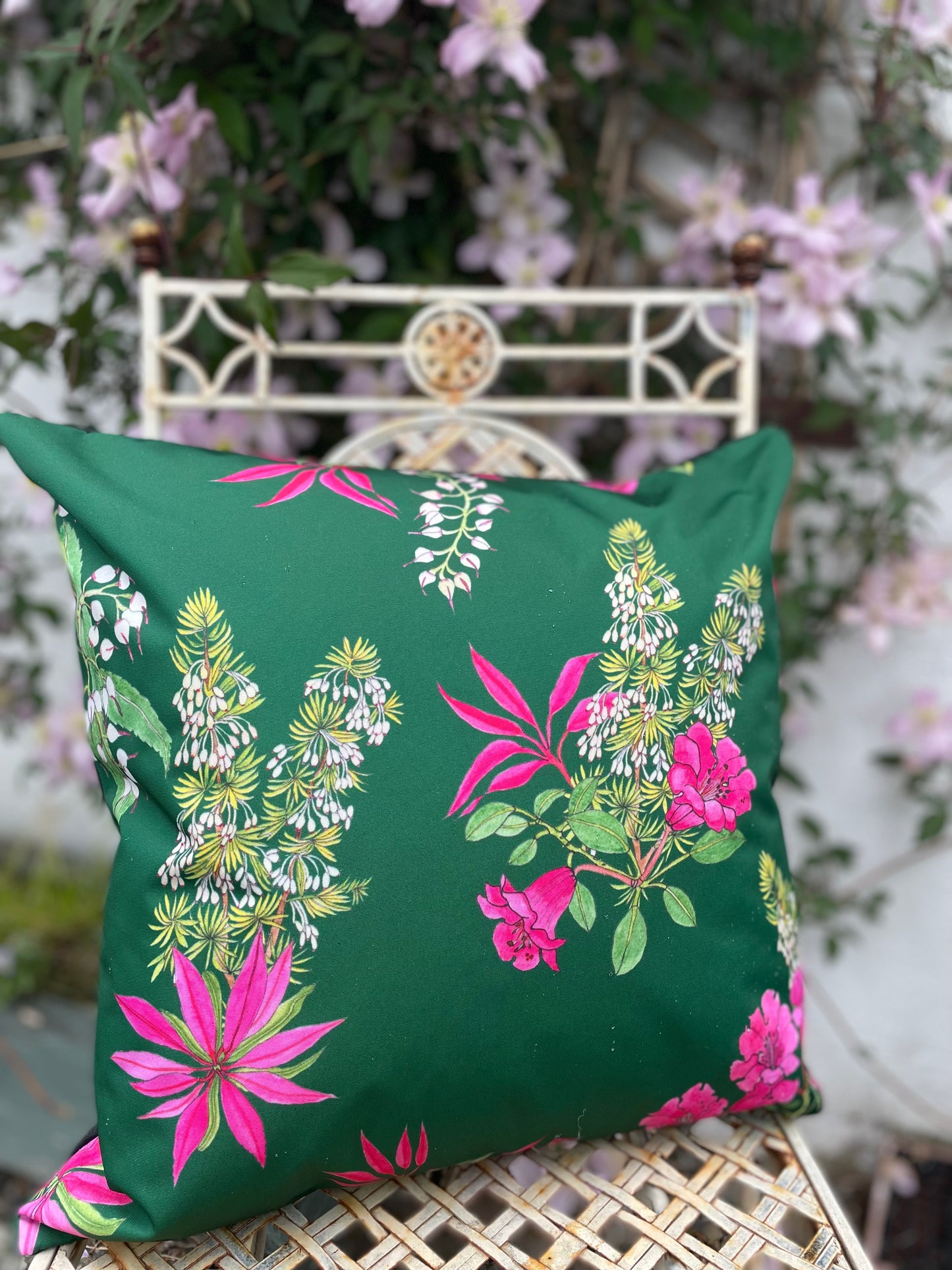 Outdoor cushion in dark green with bright pink floral print of Rhododendrons, Perris