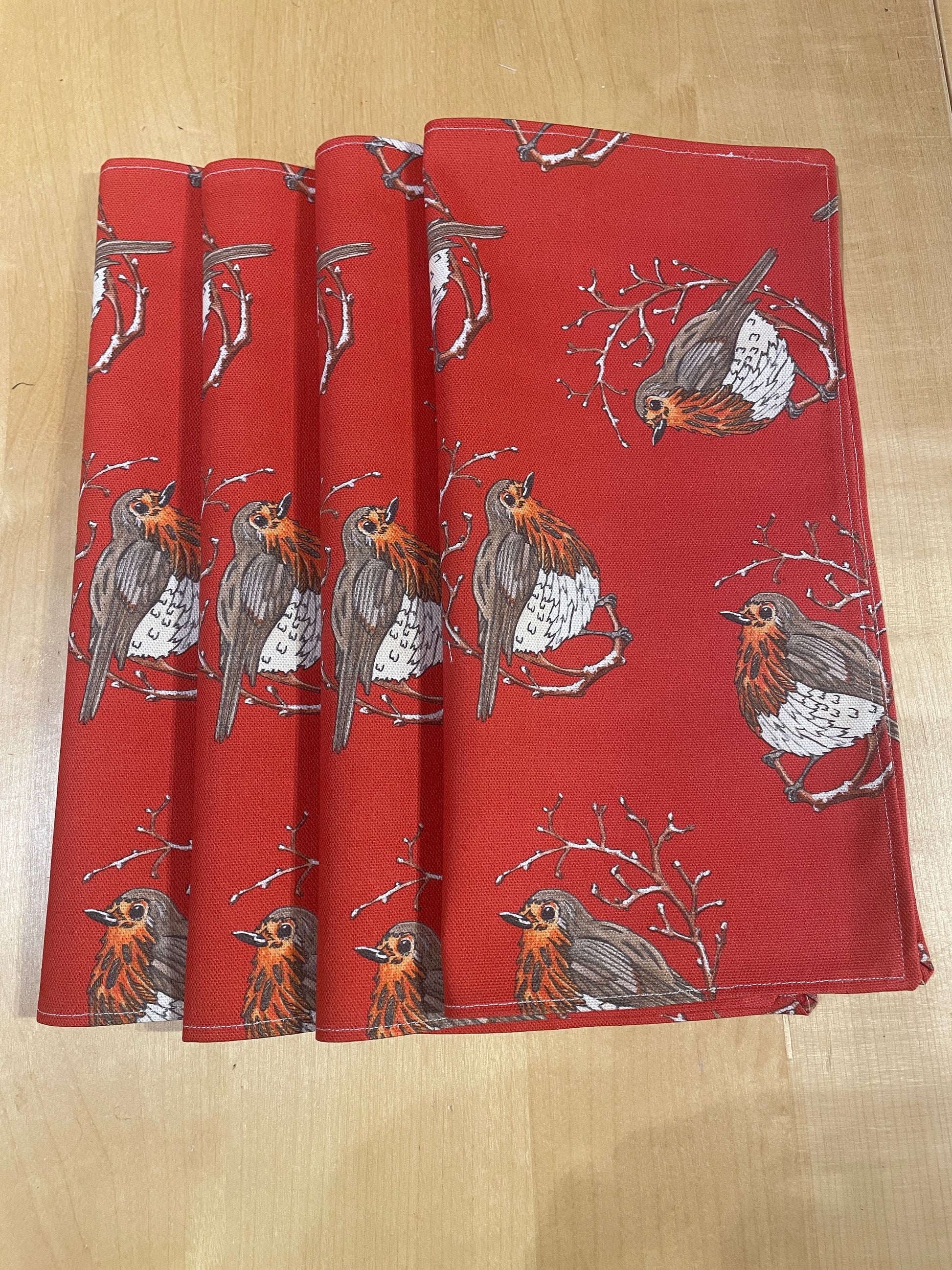 designer napkins illustrated with plump red Robin