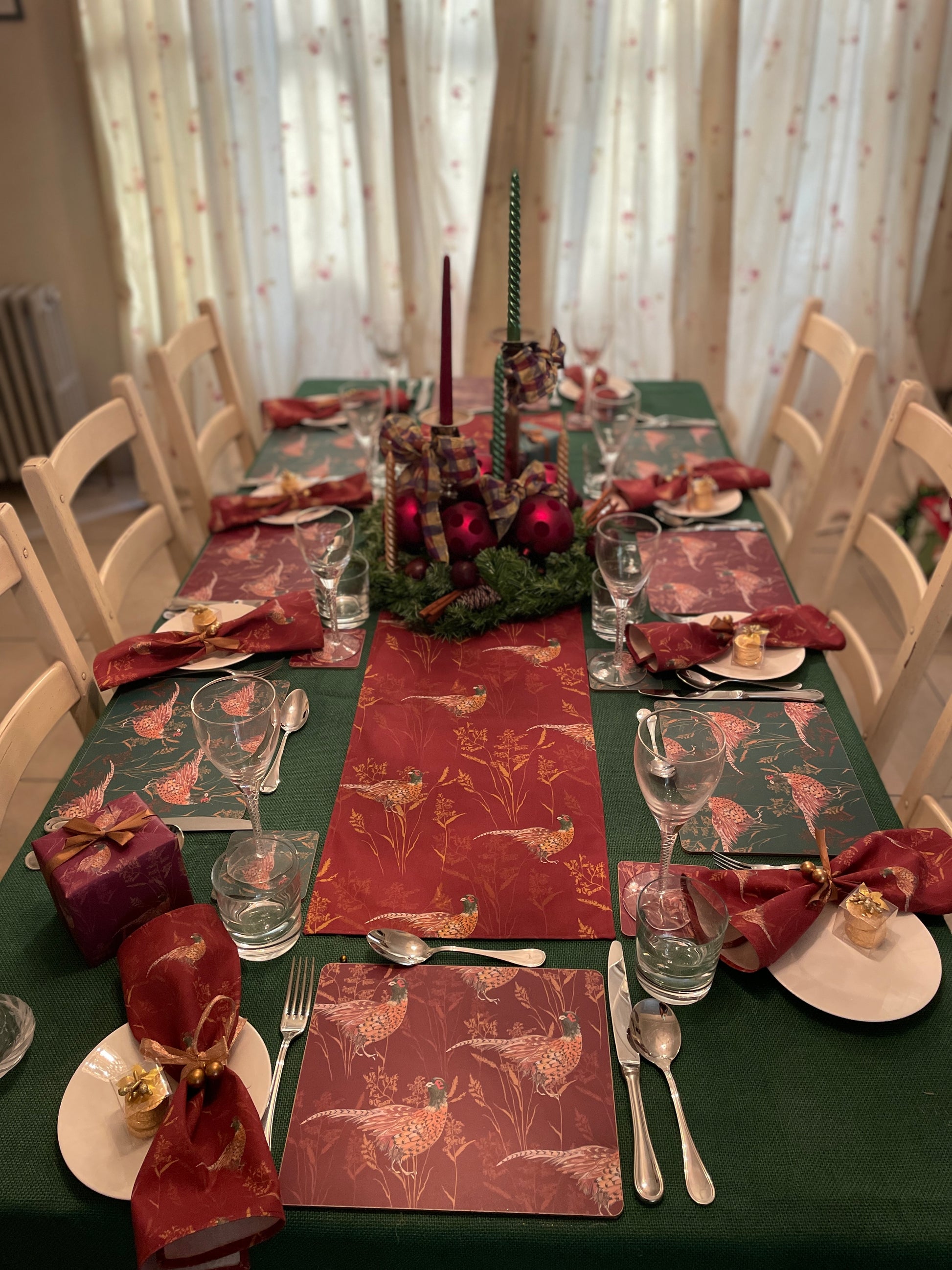 formal dining table with pheasant table runner, placemats, coaster and napkins in burgundy and green