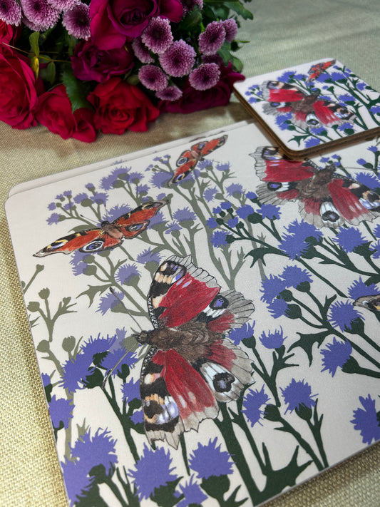 Scottish Peacock butterfly illustrations on cream background printed on placemats and coasters. Bouquet of pink red and purple flowers in picture