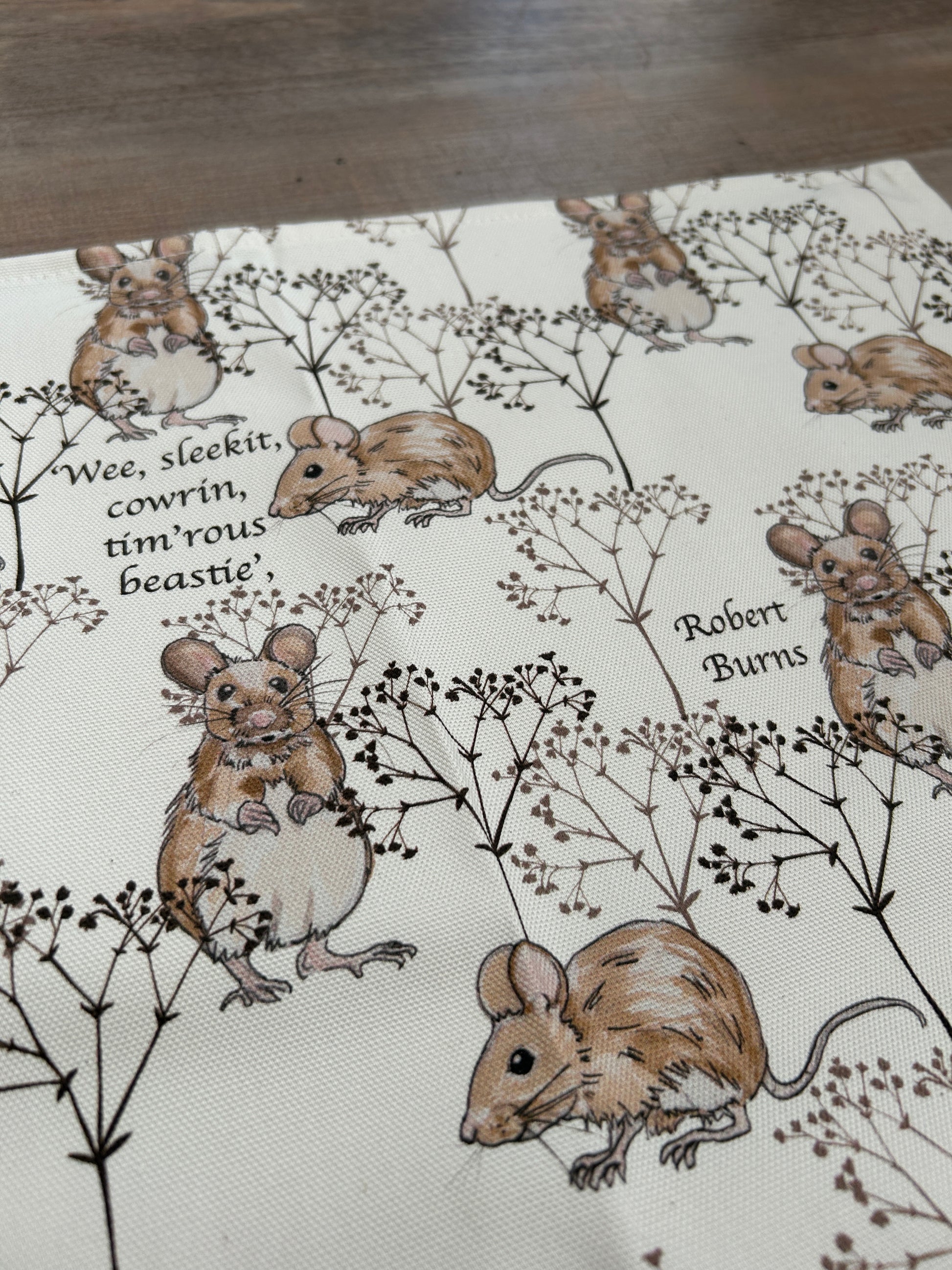 Robert Burns quote with harvest mice design and little twigs on white tea towel