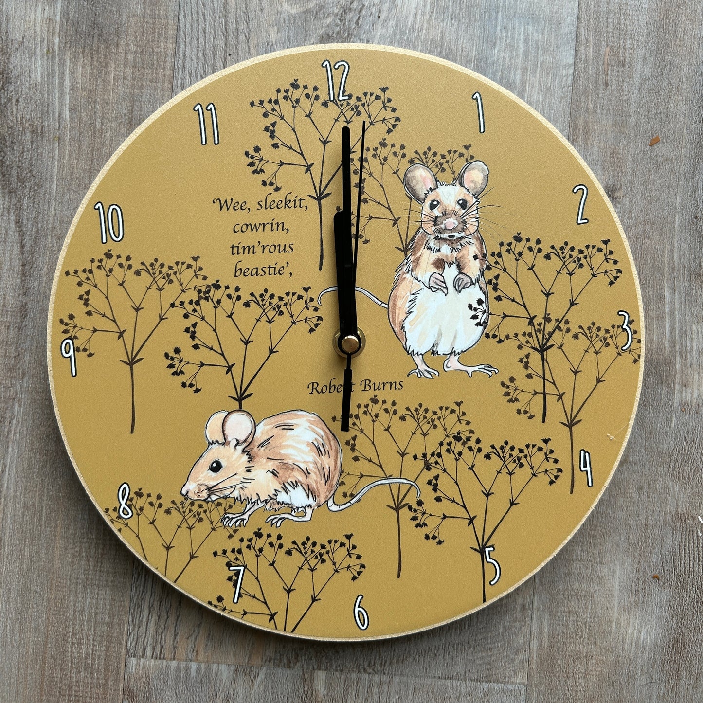 Mice illustrations with twig background and Burns' quote, wooden clock