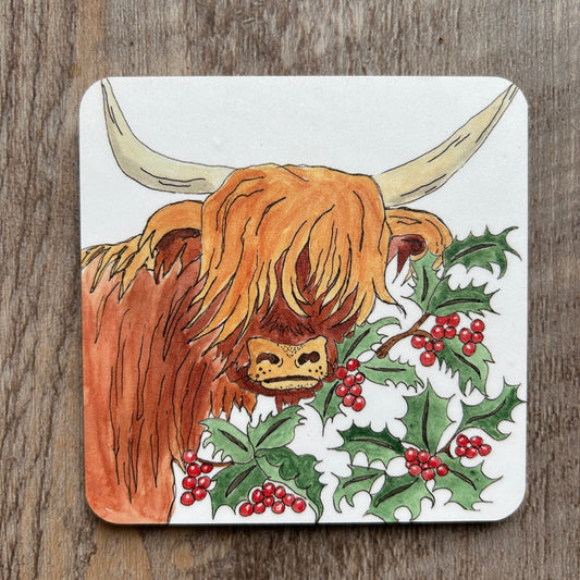 Highland cow and holly berry illustration on a white background coaster