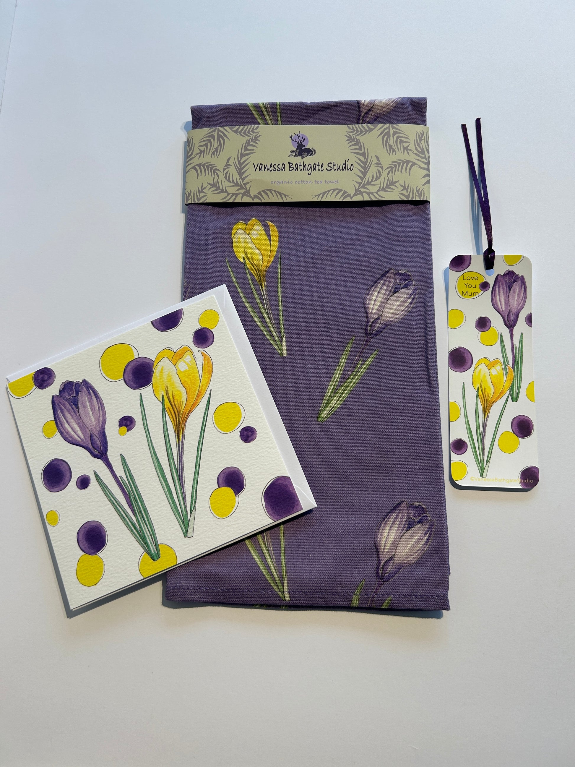 Purple Crocus print tea towel with white book mark and artist card in same print