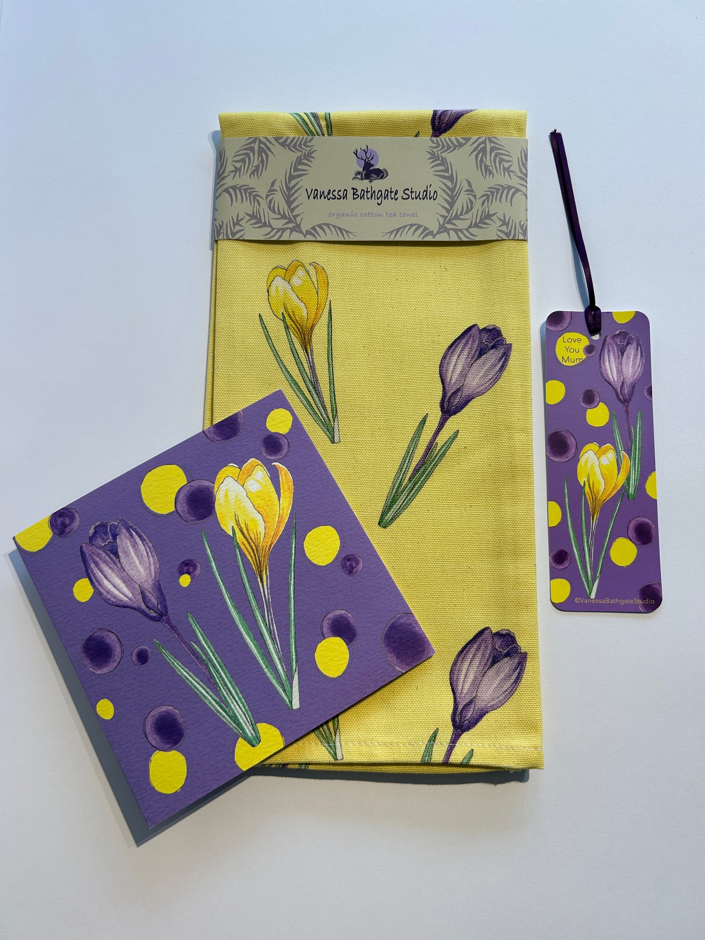 Yellow Crocus print tea towel with purple book mark and card in matching print