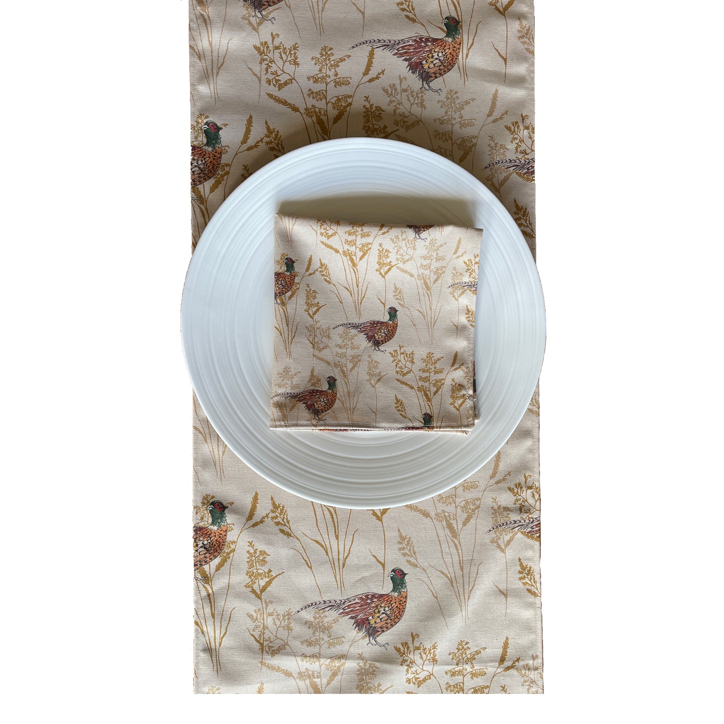 Table runner with plate and napkin setting. In cream fabric with original , Pheasant and Grass design.