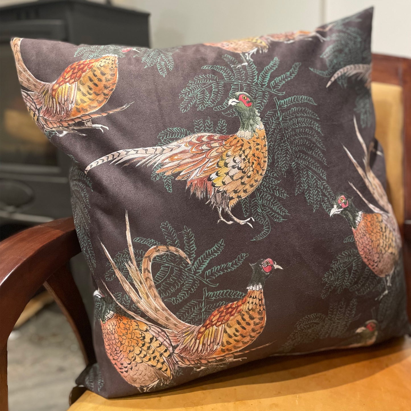 Large brown cushion with illustrated pheasants and ferns