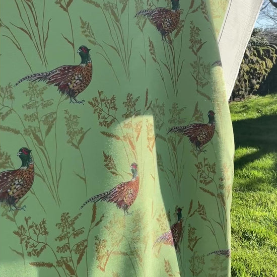 Summer Pheasant design. Green light weight table cloth  flapping in the breeze