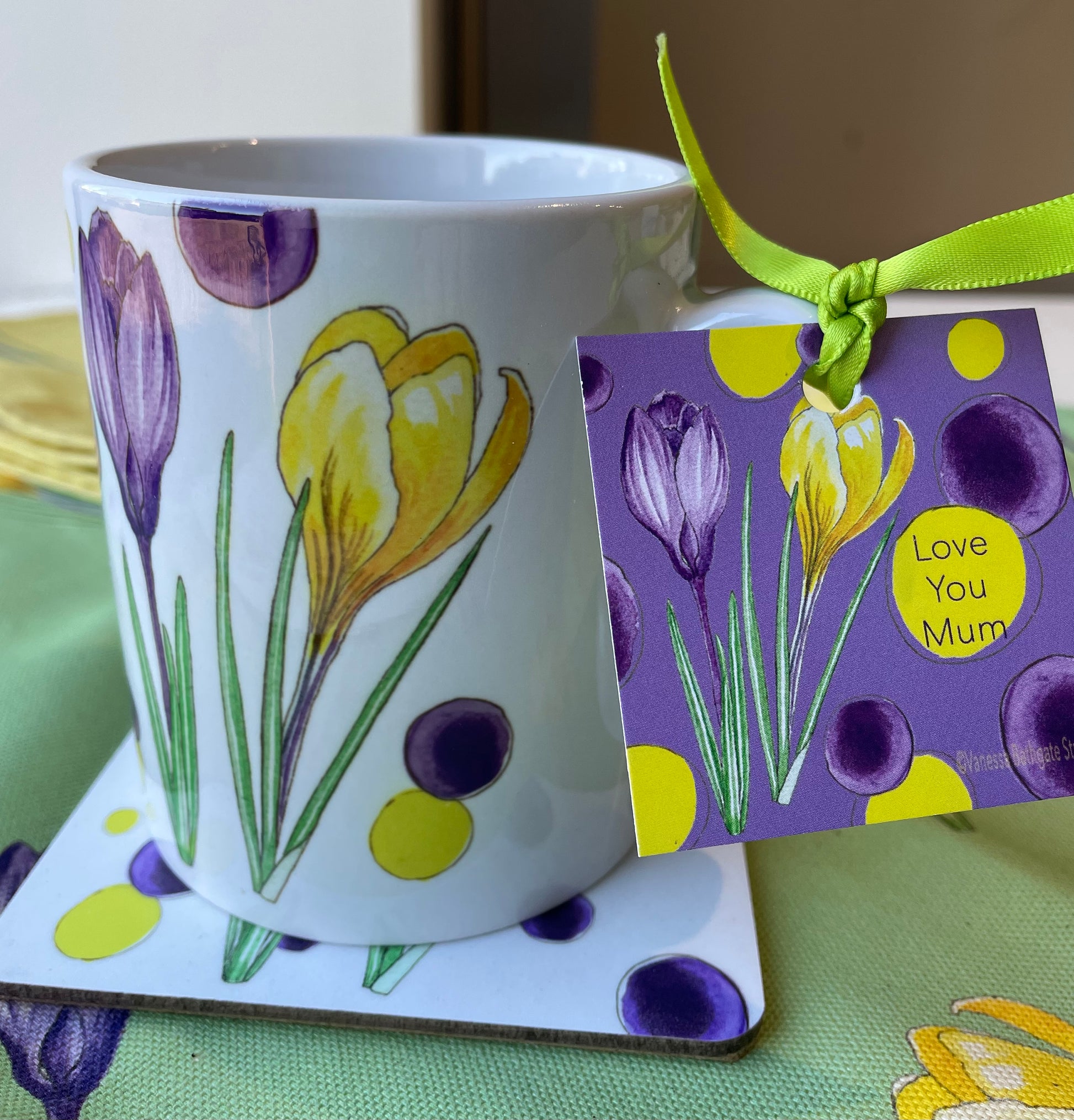 Crocus illustration on white ceramic mug with 'Love You Mum' purple gift tag