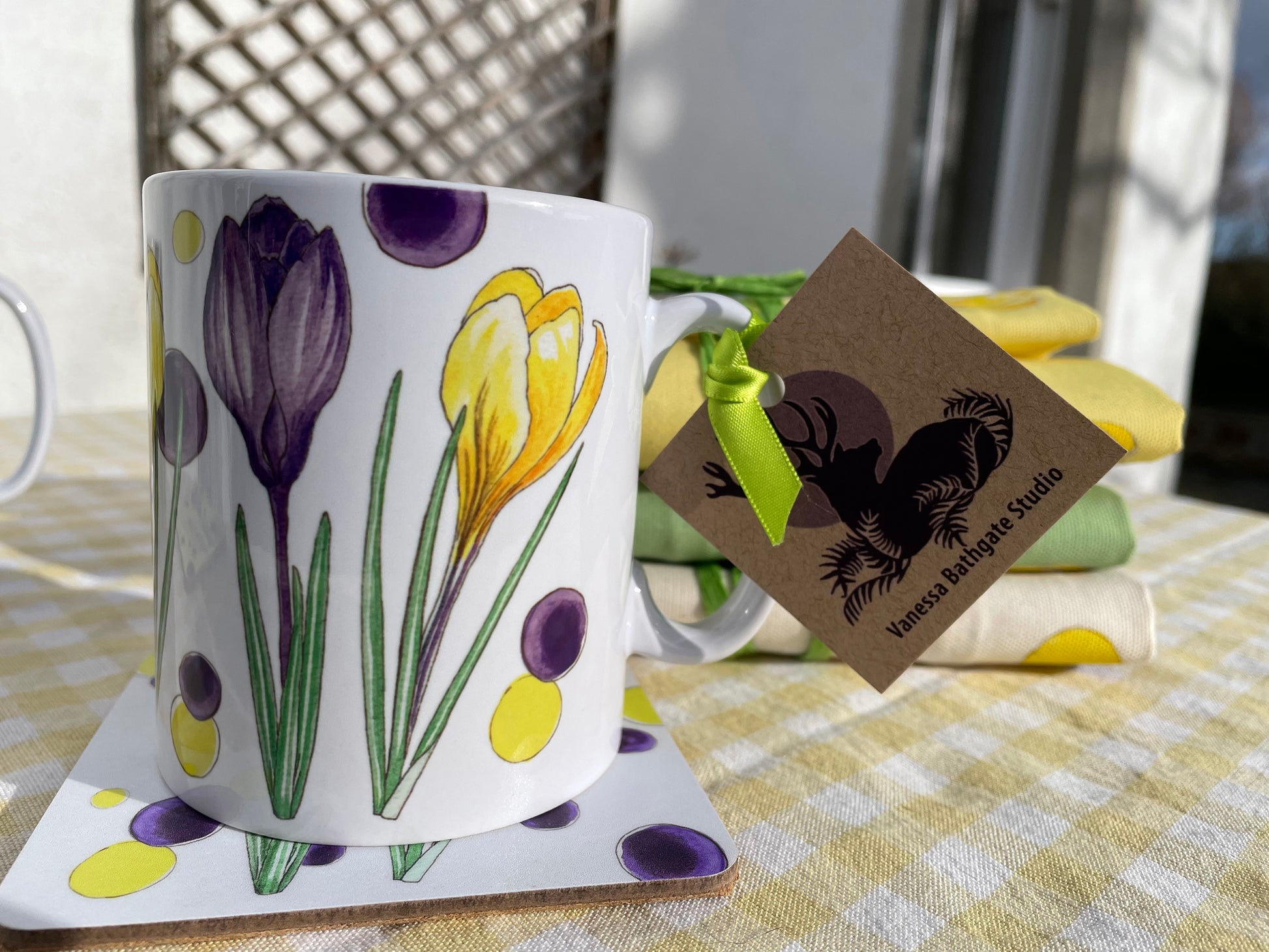 White ceramic mug with yellow and purple Crocus illustrations